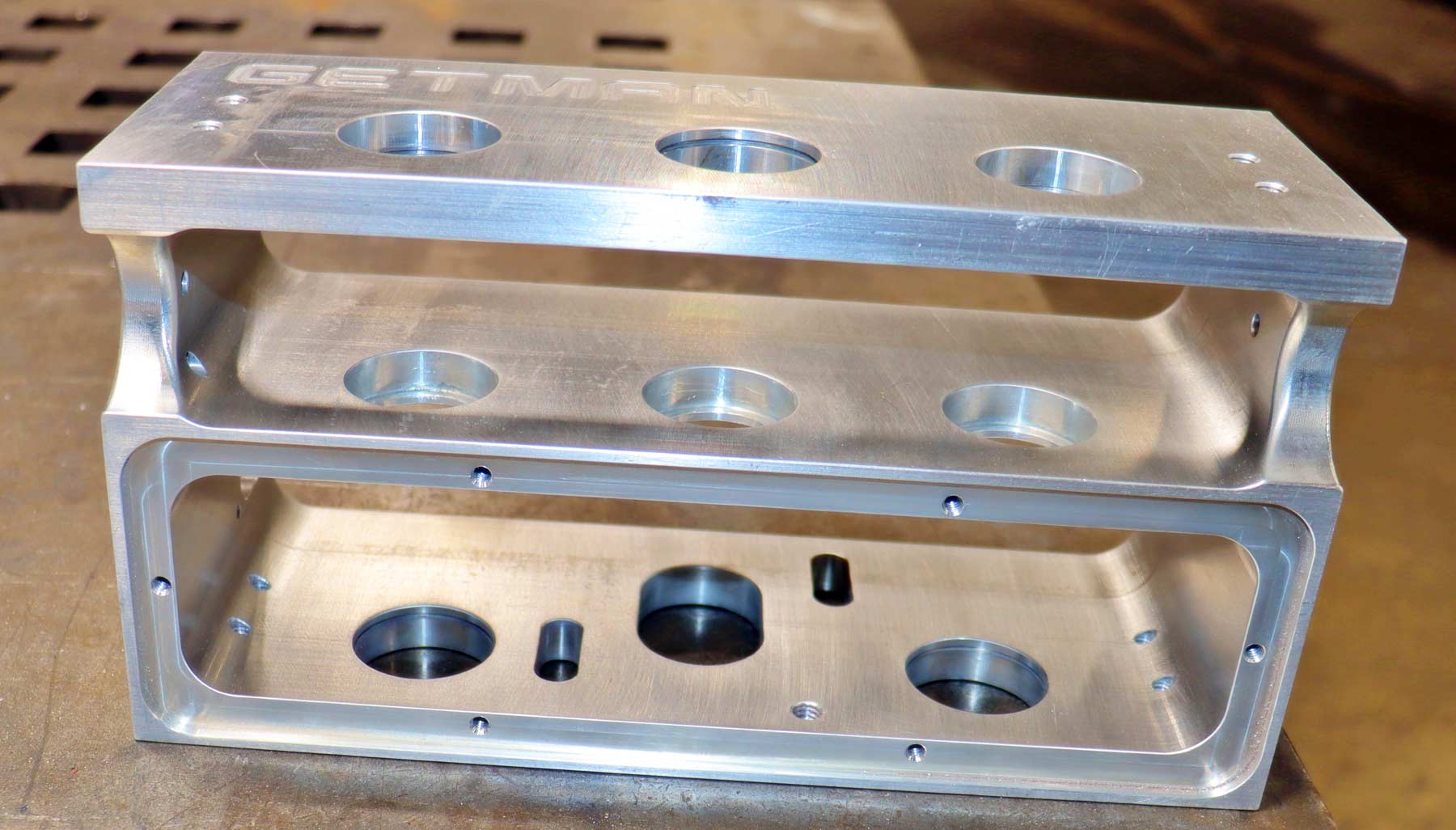aluminum manifold with three sets of plates and machined holes