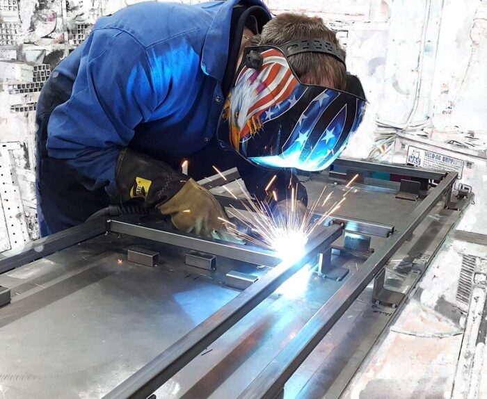 man welding with sparks flying