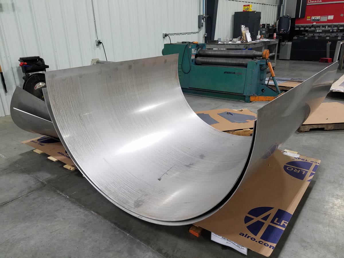 large curved bent metal pieces on pallet